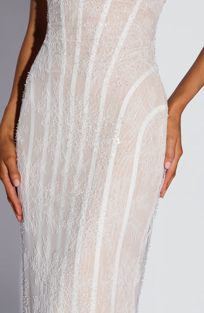Close-up of the white lace midsection, showing the floral lace, small beads and sequins, and the curved boning lines over a nude lining. 12