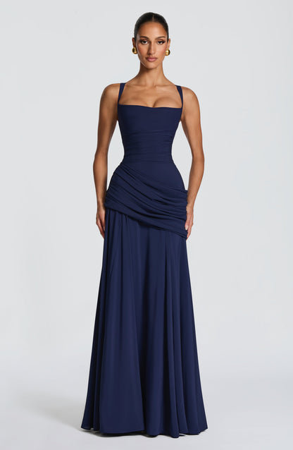 Front view of the navy chiffon maxi dress on a model, showing the square neckline, ruched bodice and asymmetric draped hip. 7