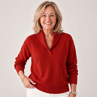 Laughing woman posing with one hand on her hip, wearing the jumper in rust red. 7