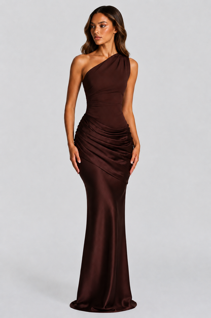 Dark chocolate brown version worn by a model, front three-quarter view, glossy satin with pleated draping at the hip. 6