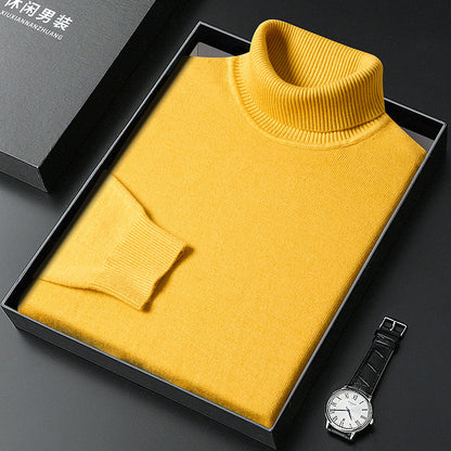 Folded yellow roll-neck jumper with ribbed collar and cuff in a black box, with a white-faced wristwatch and lidded gift box. 9