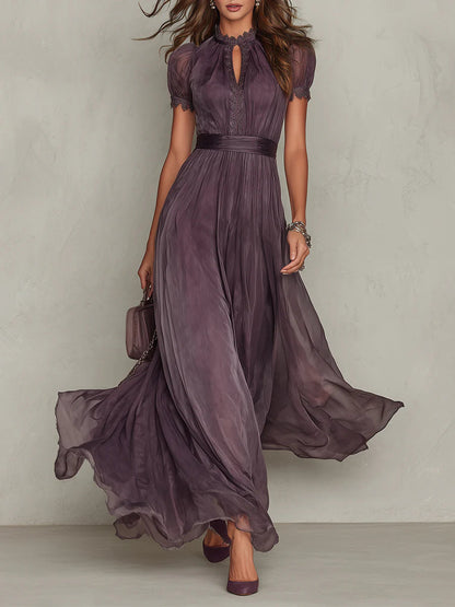 Full-length front view of the purple maxi dress on a model, showing lace trim, keyhole neckline, gathered waist and flowing skirt. 1
